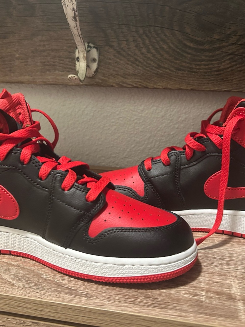 Jordan 1’s . Youth size 6.5. Women’s 8.Red and Black Low-Top Basketball Sneakers